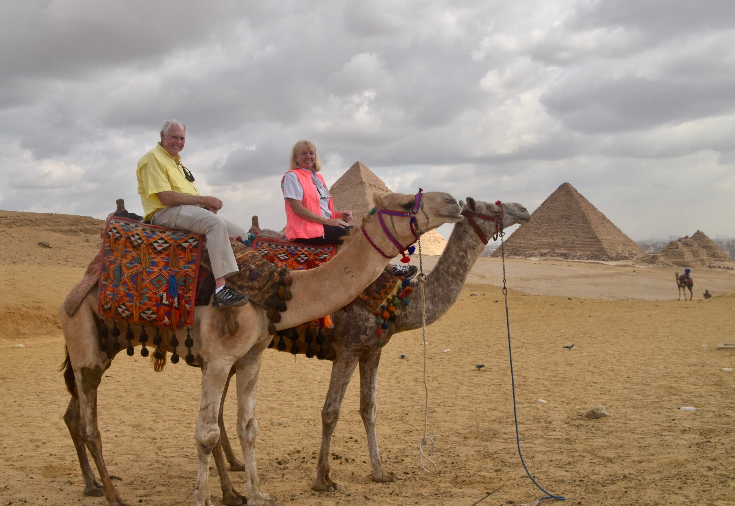 John and Janice on camels in front of the Giza pyramids
