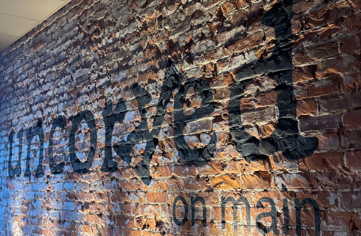 The exposed brick wall inside Uncorked on Main in Georgetown